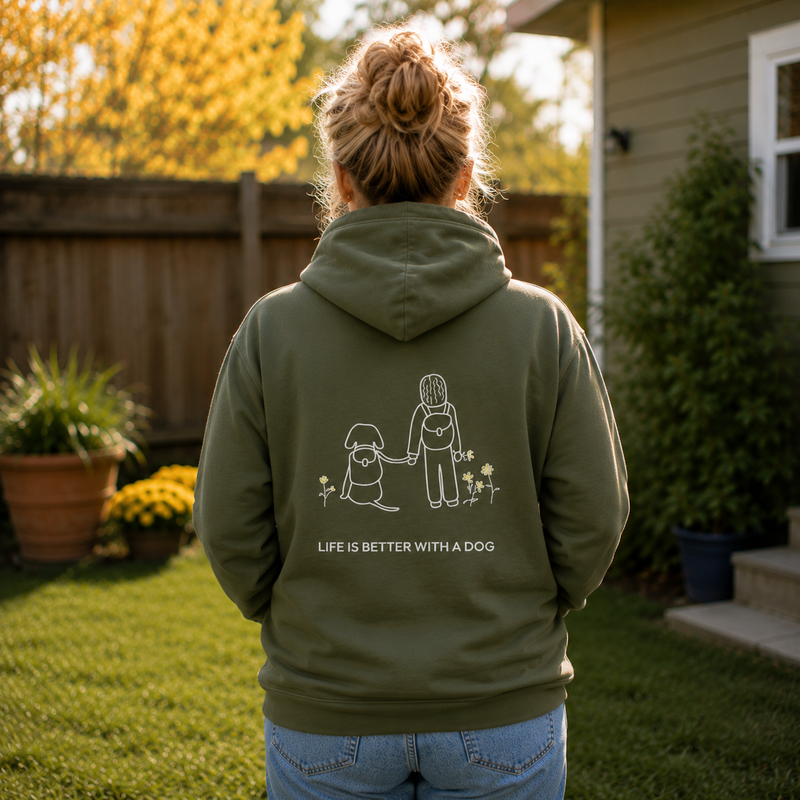 MoreWoof Dog Hiking hoodie with a person and dog hiking past wildflowers
