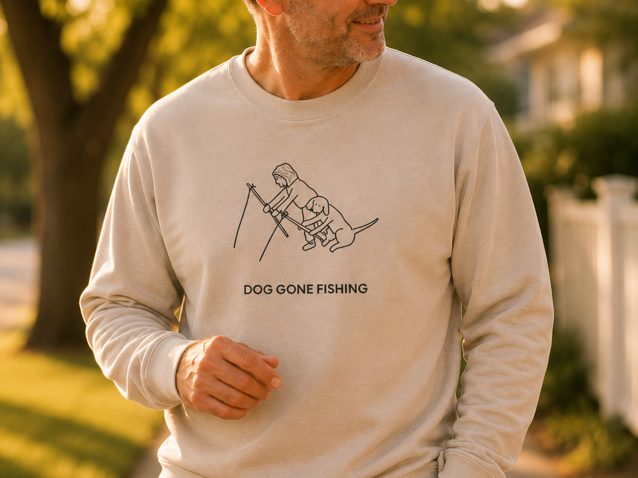 Dog Gone Fishing sweatshirt featuring a person fishing with their dog