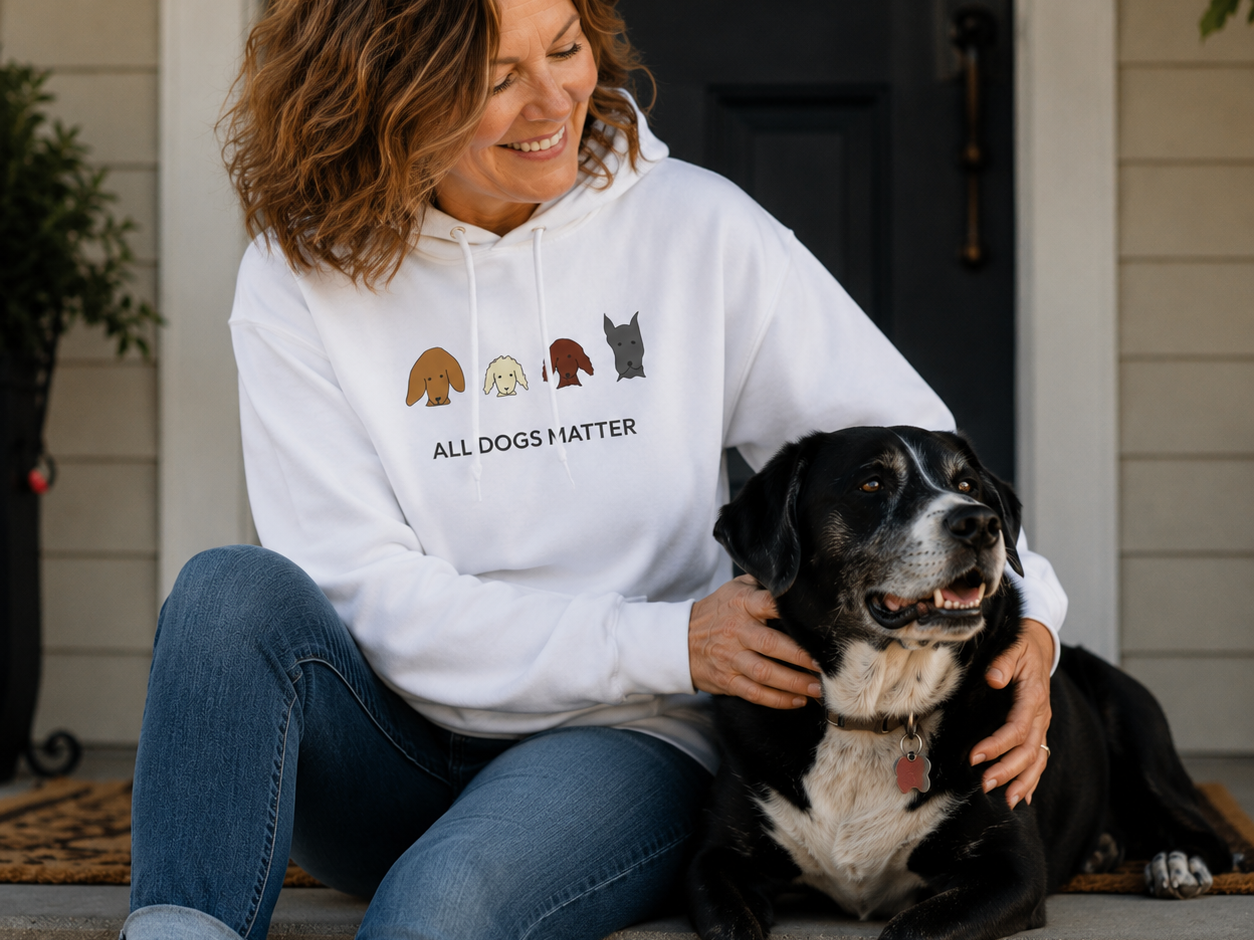 All Dogs Matter color collection hoodie featuring four hand-drawn dog heads beside the words
