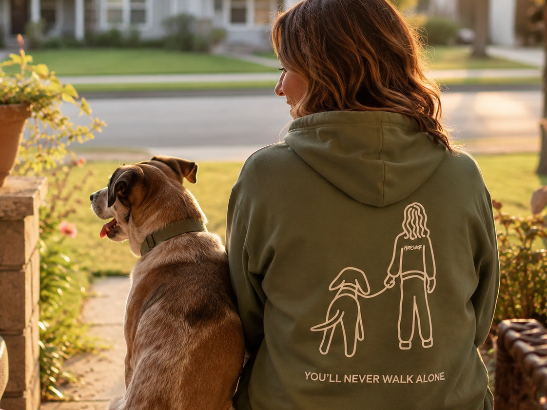 Never Walk Alone hoodie featuring a person walking their dog on a leash
