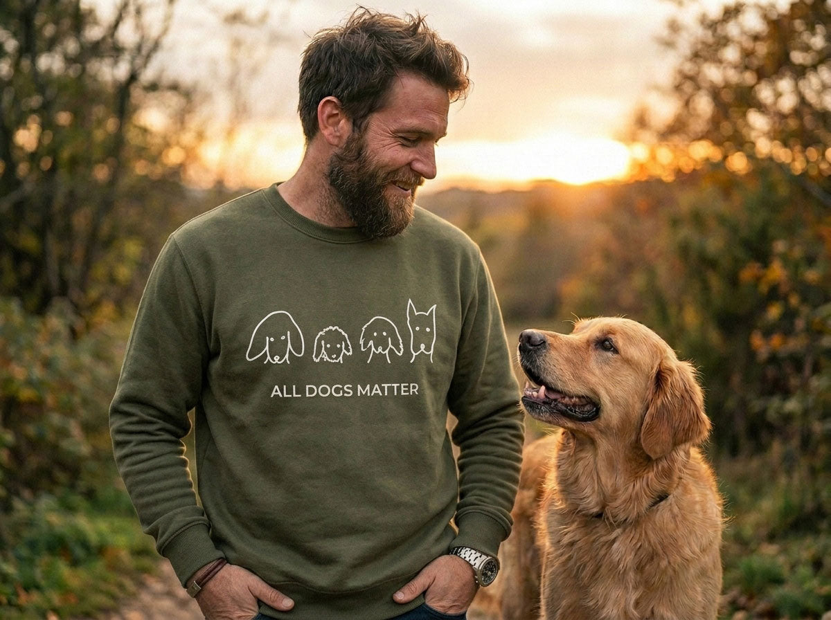 A man wearing a MoreWoof hoodie with his dog