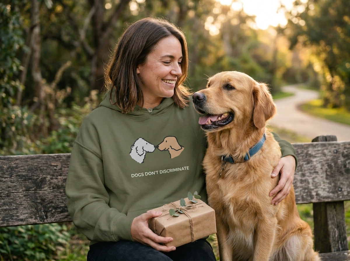A woman holding a gift with her dog
